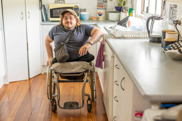 A support worker assisting a participant with their morning routine in a warm home setting